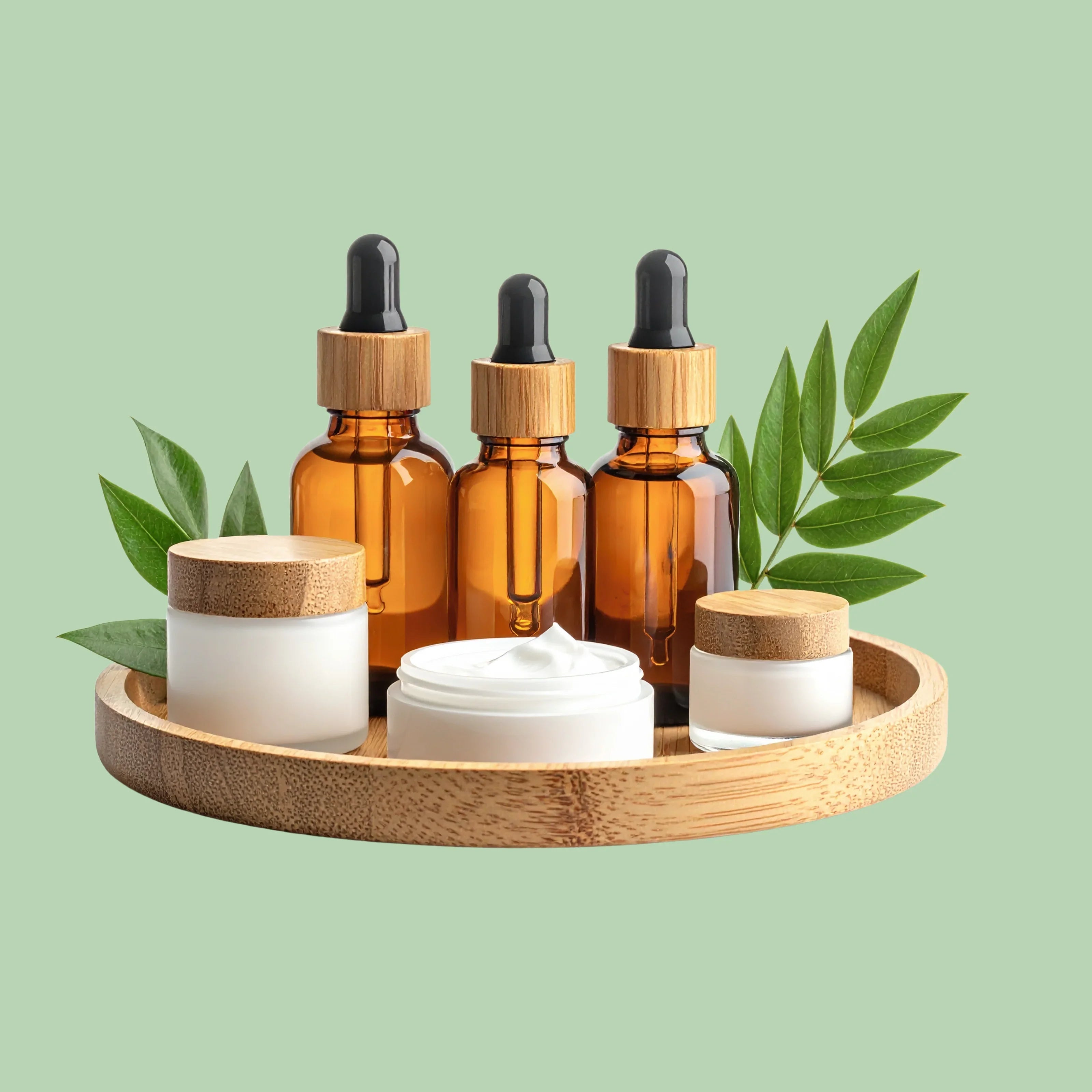 Natural skincare bottles and cream jars on bamboo tray with green leaves, Shoppiearth UK